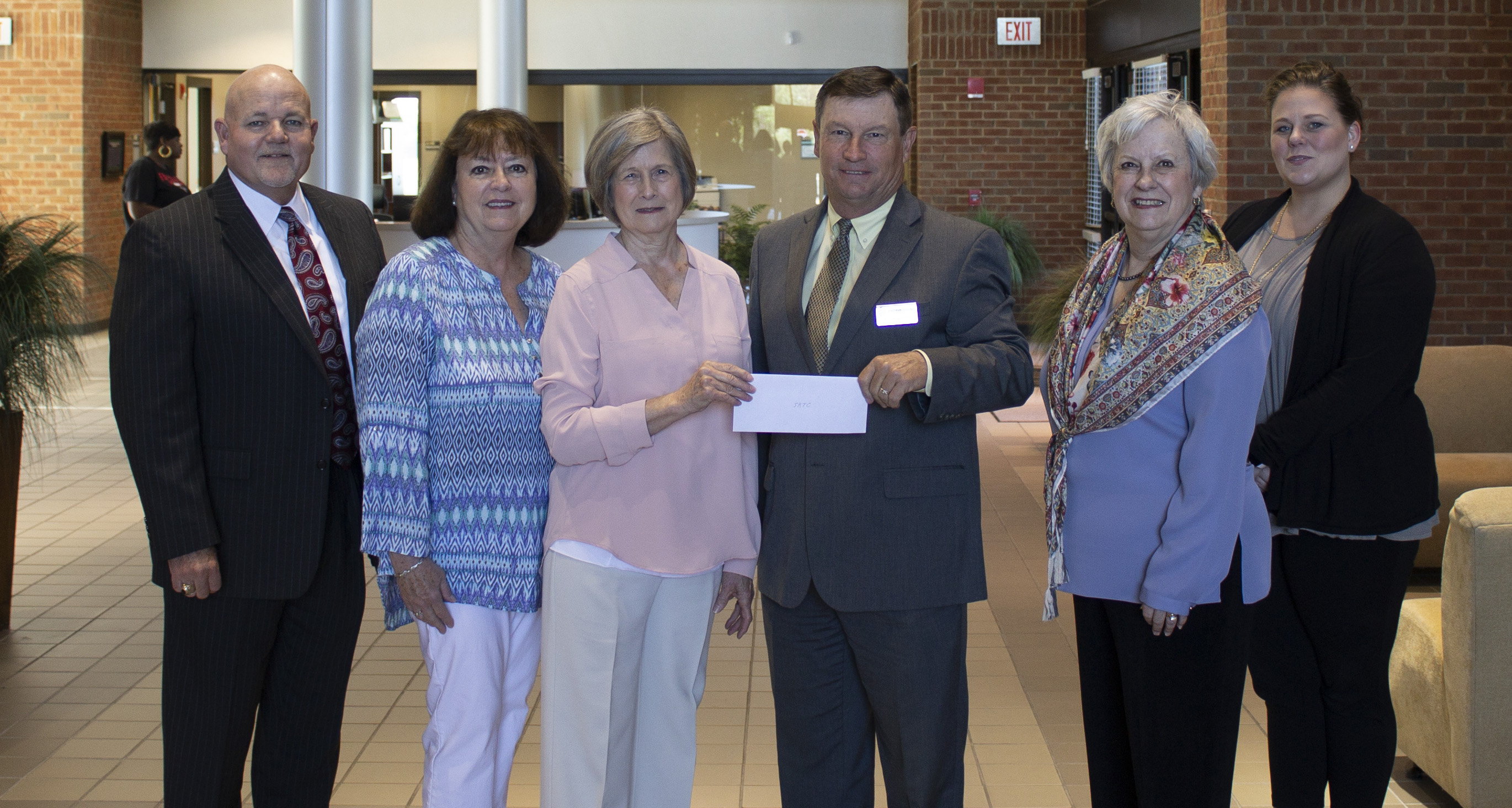 group photo of check presentation Left to Right: Jim Glass, Provost/Vice-President for Academic Affairs; Elizabeth Herndon, Moultrie Federated Guild President; Mary Vines, Antique Show Coordinator; Dr. Craig Wentworth, SRTC President; Lesa Moser, Antique Show Dealer Coordinator; Amy Maison, Vice-President for Institutional Advancement, Marketing, and Public Relations.